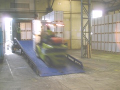 Fork lift loading a container